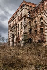 Low angle view of old ruin against sky