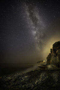 Scenic view of sea against sky at night