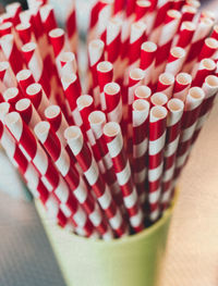Close-up of paper drinking straws on table