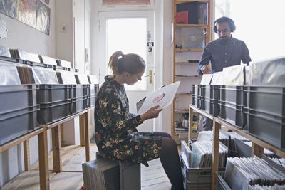 Young couple shopping for records together