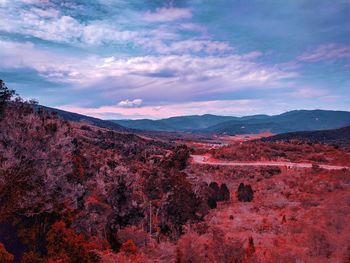 Scenic view of landscape and mountains against sky