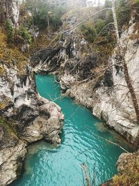 High angle view of sea by cliff