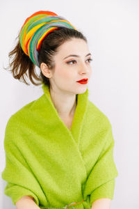 Portrait of a beautiful young woman over white background