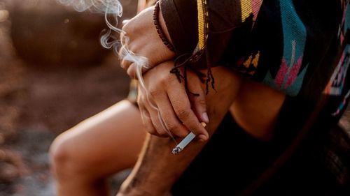 Close-up of woman smoking cigarette