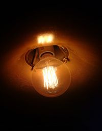 Low angle view of illuminated light bulb