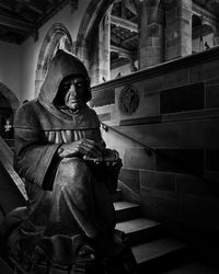 Low angle view of statue against building