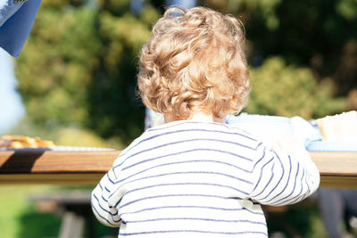 Rear view of woman wearing hat outdoors