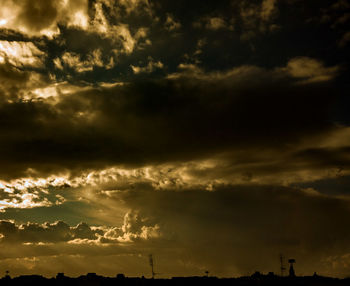 Low angle view of cloudy sky at sunset