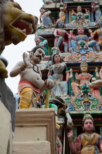 Low angle view of statues against building