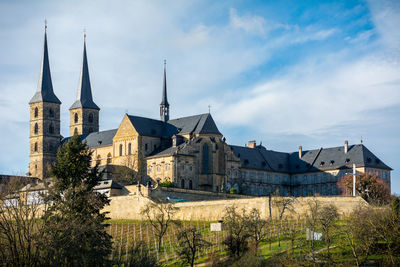 Michaelsberg abbey against cloudy sky during winter
