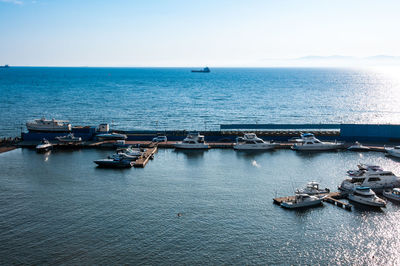 High angle view of boats in sea against clear sky