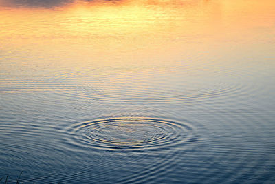 High angle view of rippled water in lake at sunset