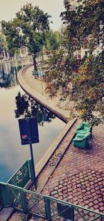 High angle view of footpath by street in city