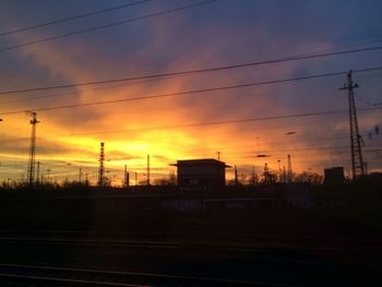 Electricity pylons at sunset