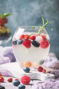 Close-up of strawberries in glass on table