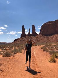 Full length of man standing on rock