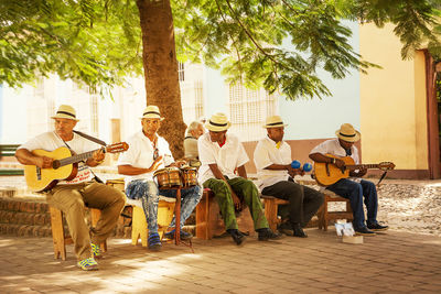 Group of people playing guitar