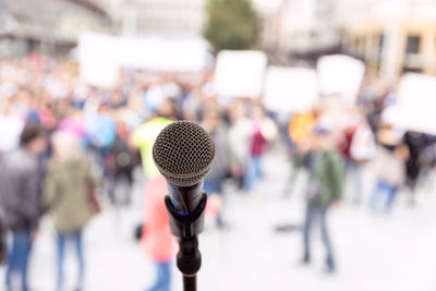 Close-up of group of people against blurred background