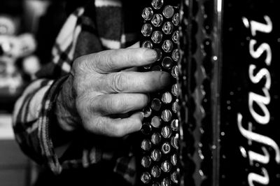 Cropped image of musician playing accordion