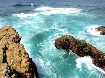 High angle view of rocks in sea