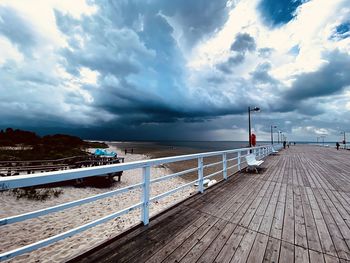 Pier over sea against sky