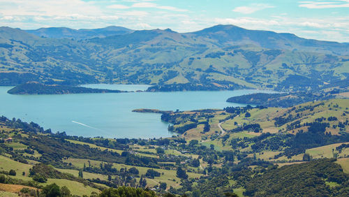 Scenic view of landscape and mountains against sky