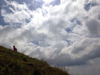 Low angle view of woman against sky