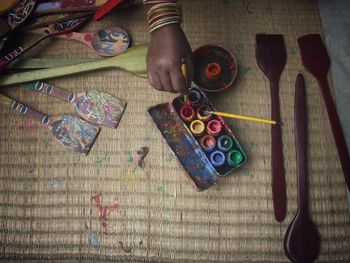 High angle view of hand painting on table