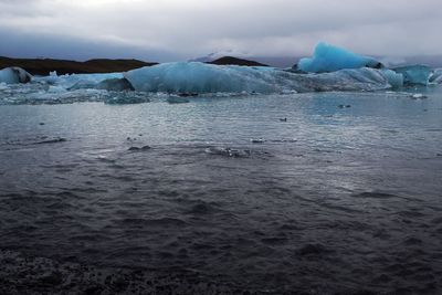 Scenic view of frozen sea against sky