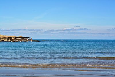 Scenic view of sea against blue sky