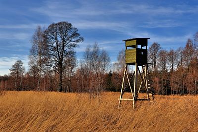 Built structure on field against sky