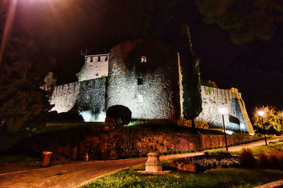 Low angle view of illuminated building at night