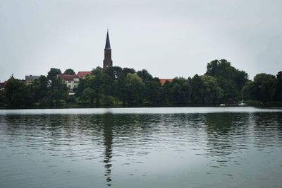 View of lake with church in background