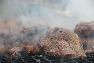 Close-up of meat on barbecue grill