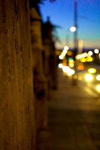 Illuminated lamp post at night