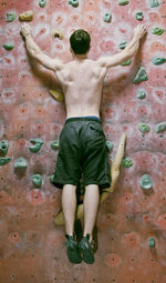 Man bouldering at indoor gym in england