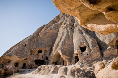 Low angle view of rock formation against sky