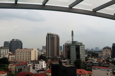 Modern buildings in city against sky