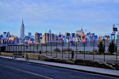 City at waterfront against sky