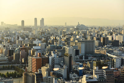 High angle view of buildings in city against sky