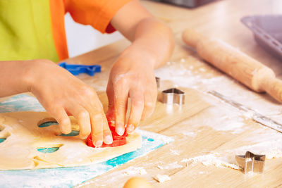 Midsection of chef preparing food on table