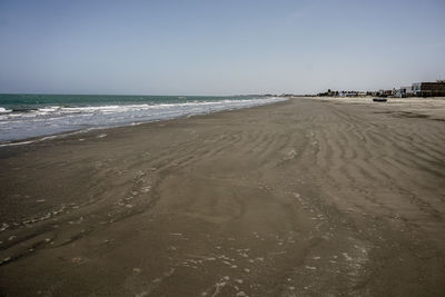 Scenic view of beach against clear sky