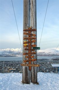 Built structure on snow covered land against sky