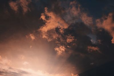 Low angle view of cloudy sky during sunset