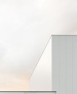 Low angle view of building against cloudy sky