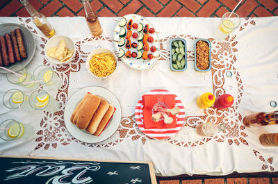 High angle view of various food and drink arranged on table