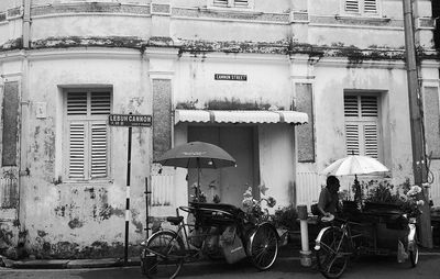 Bicycles on street against buildings in city