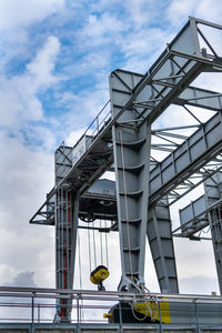 Low angle view of bridge against sky in city