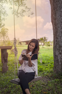 Young woman playing on field