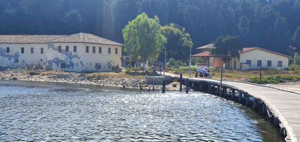 River amidst houses and buildings in city